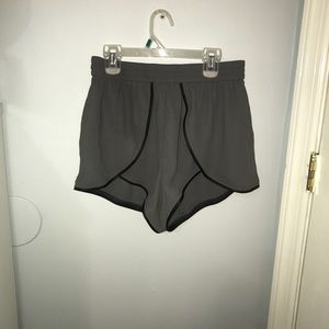 Grey parachute shorts with black leather trim